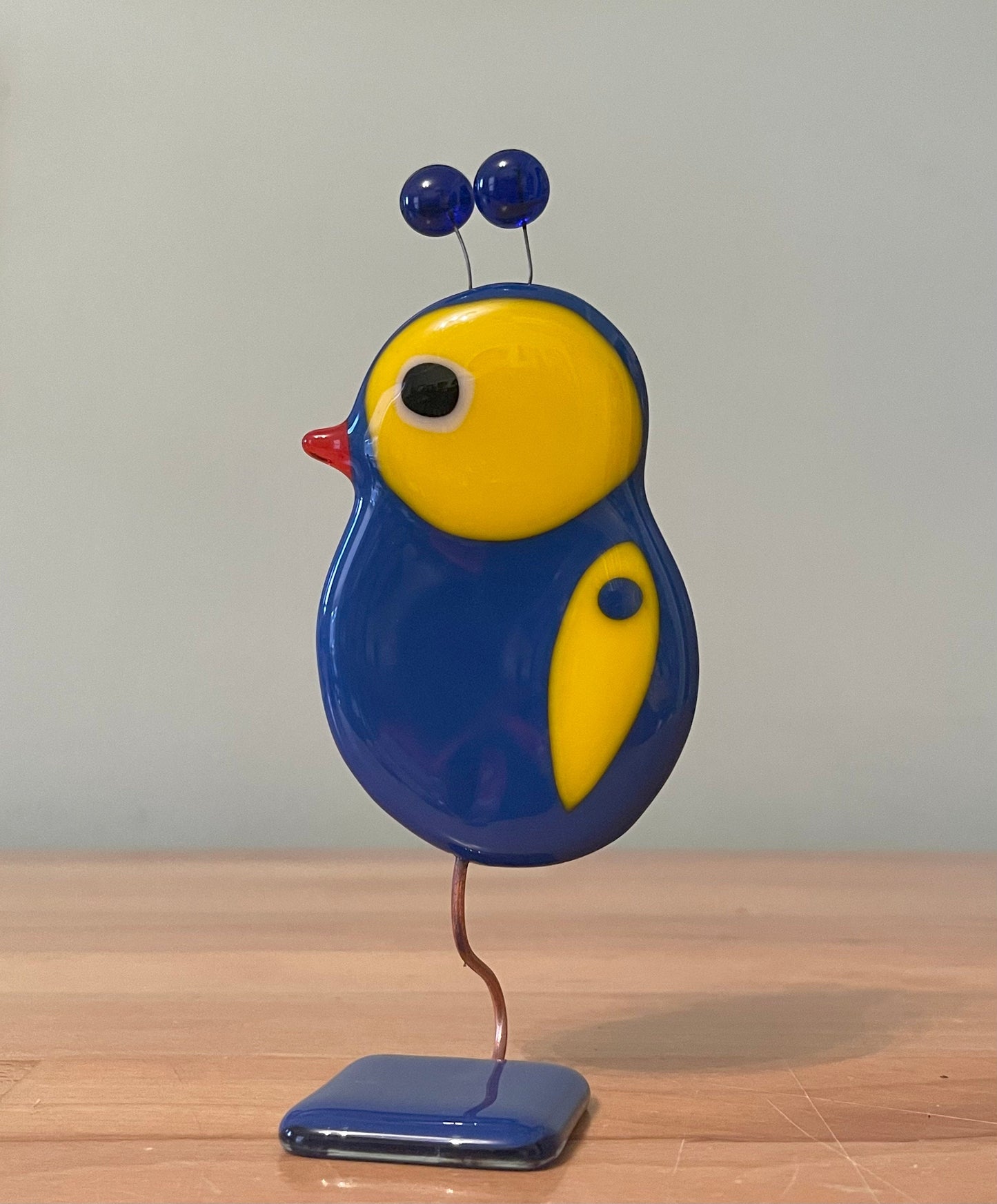 Glass Bird Sculpture on Glass Stand Blue & Yellow